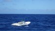 Tender Boat Drifting at Sea